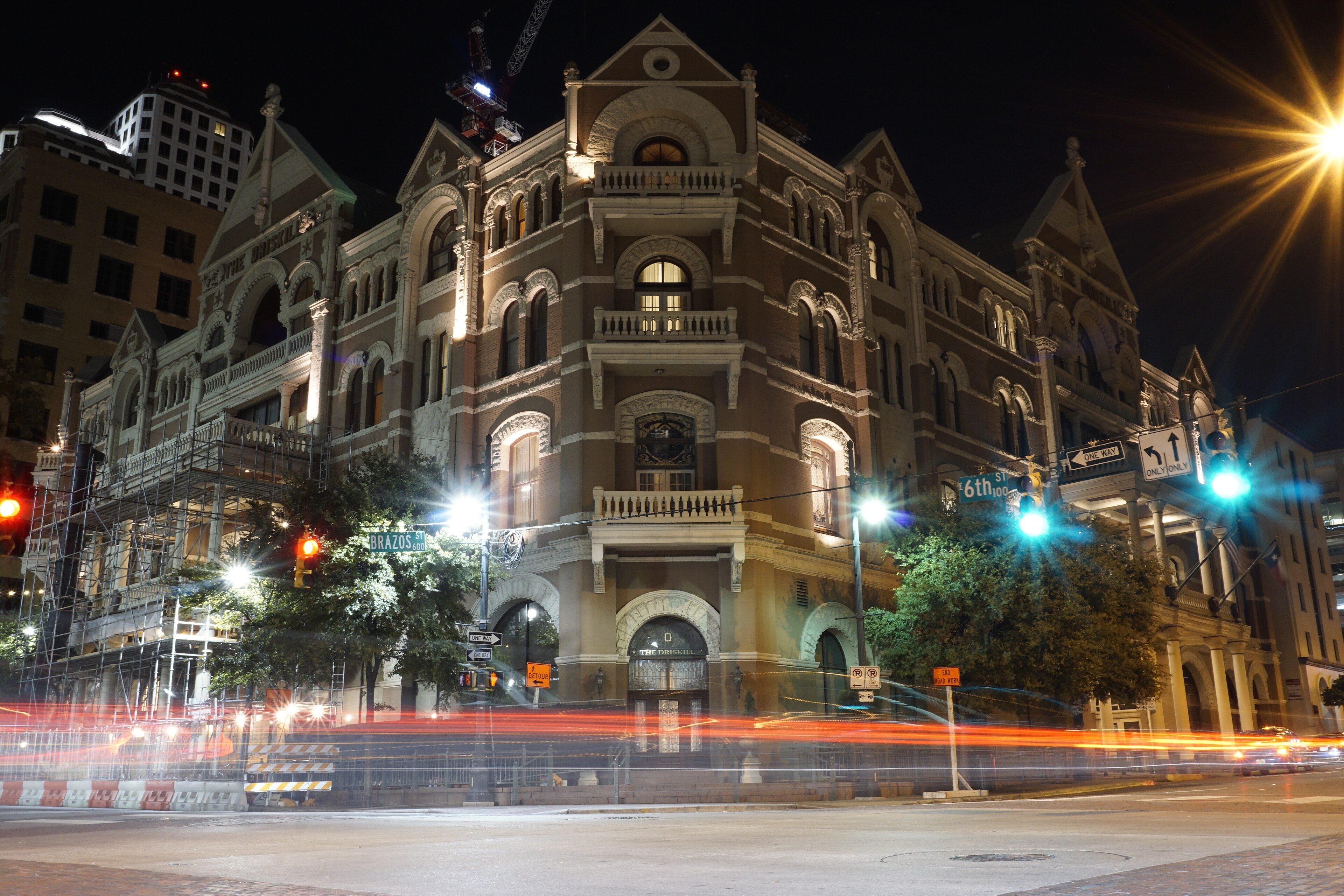 The Driskill hotel on Sixth Street at night