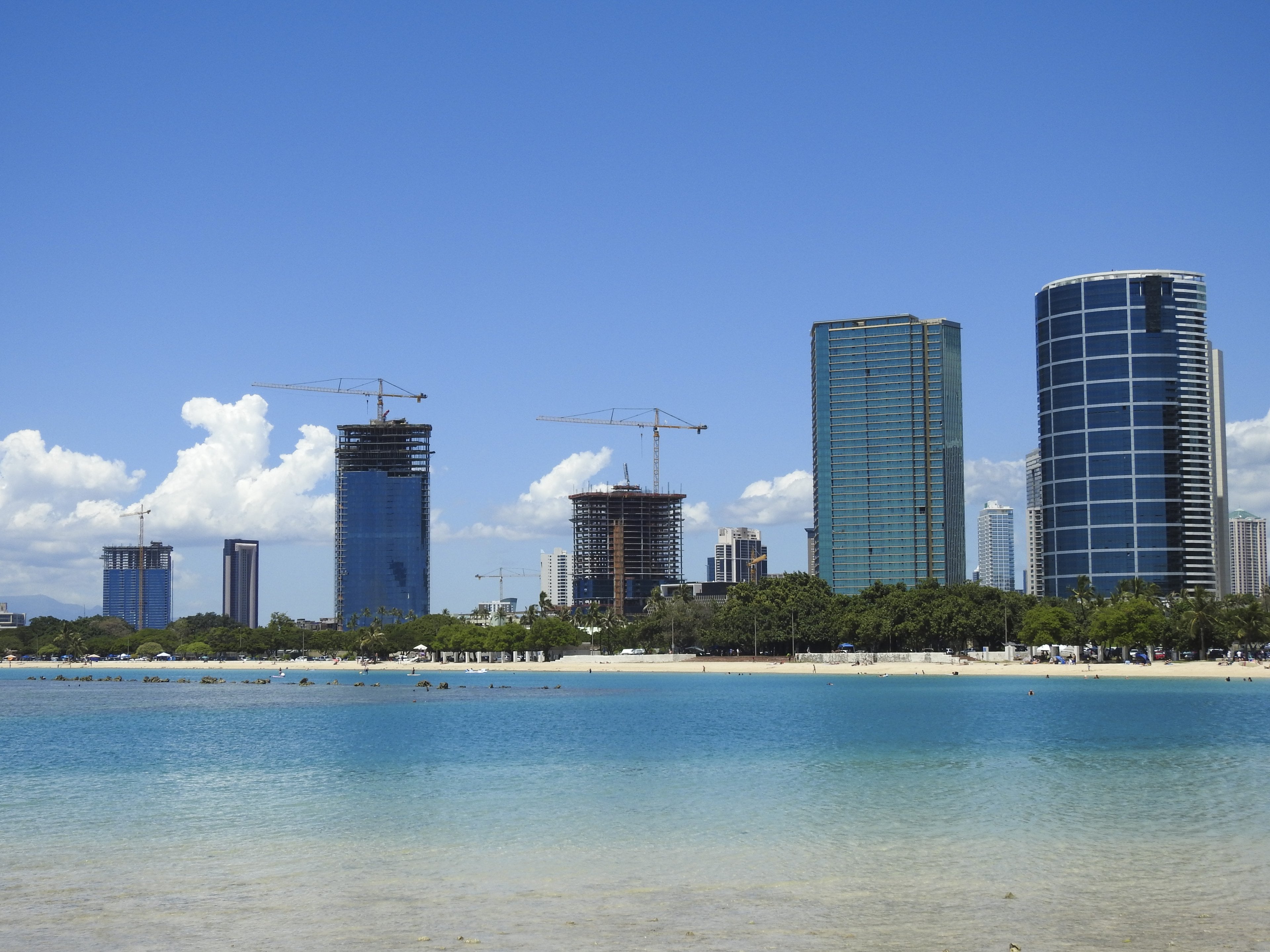 The calm water of Ala Moana Beach with Kakaʻako towers behind