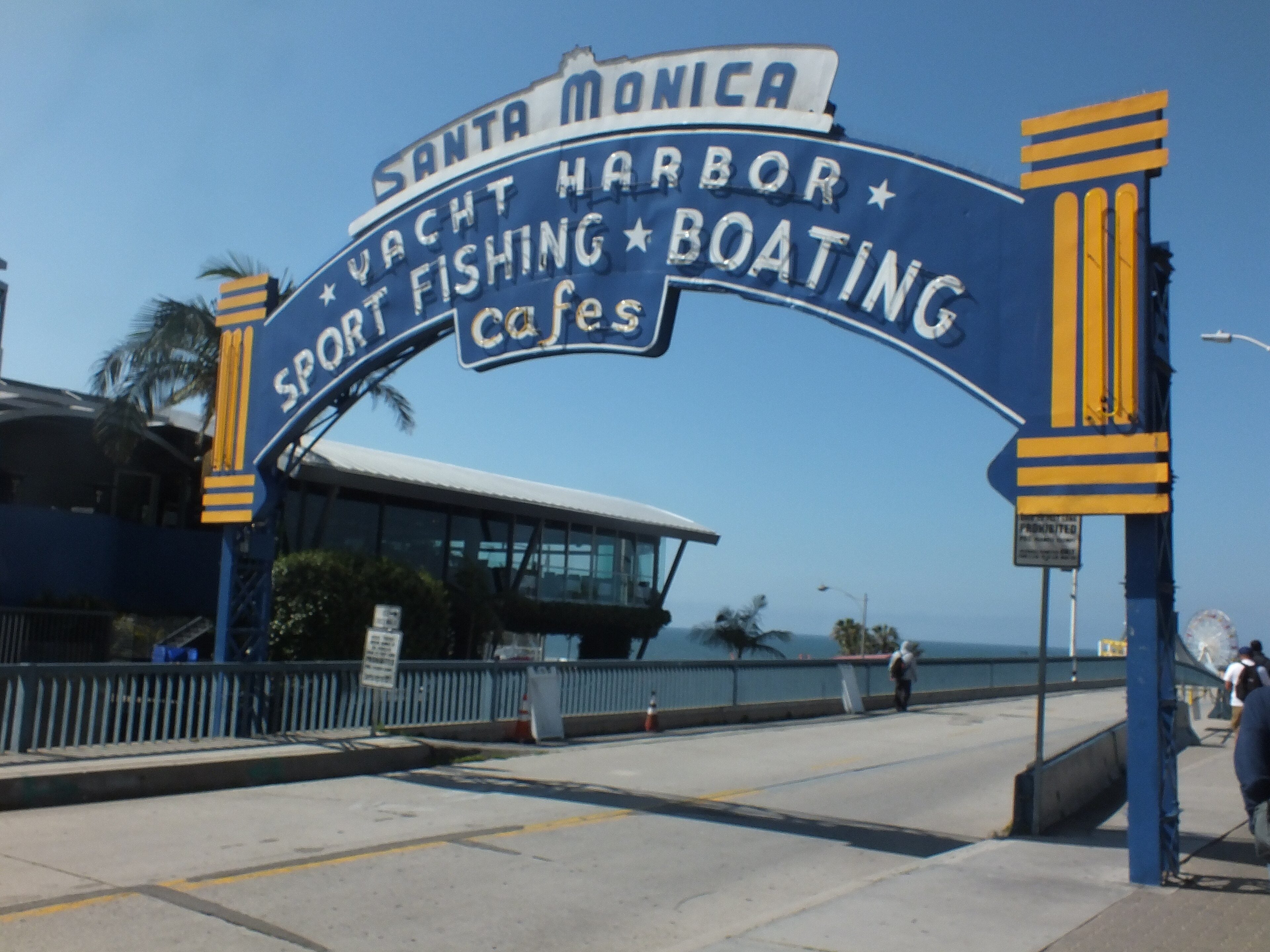 The arched Santa Monica Yacht Harbor sign at the pier entrance