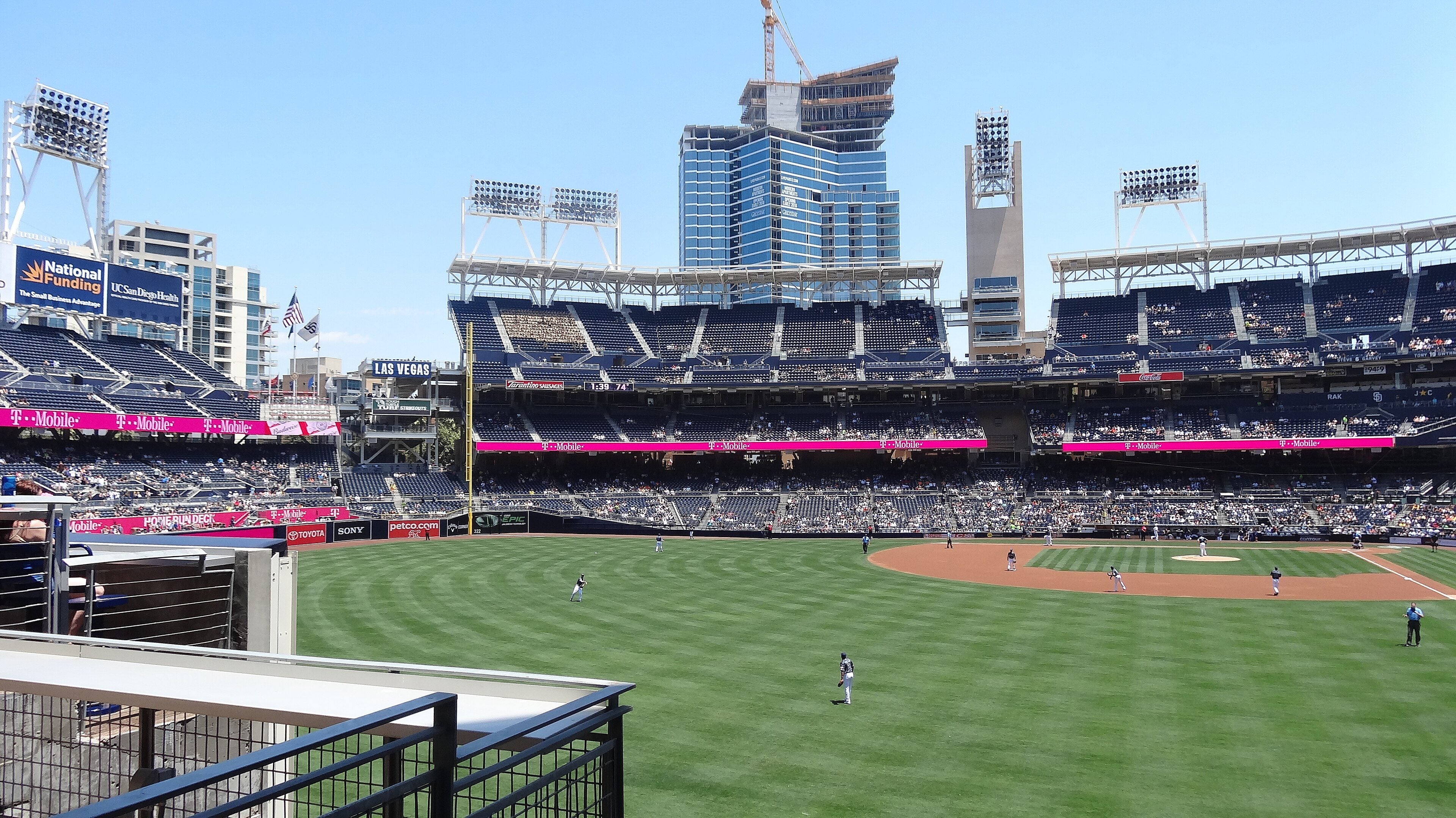 Petco Park's field and grandstand with downtown towers behind