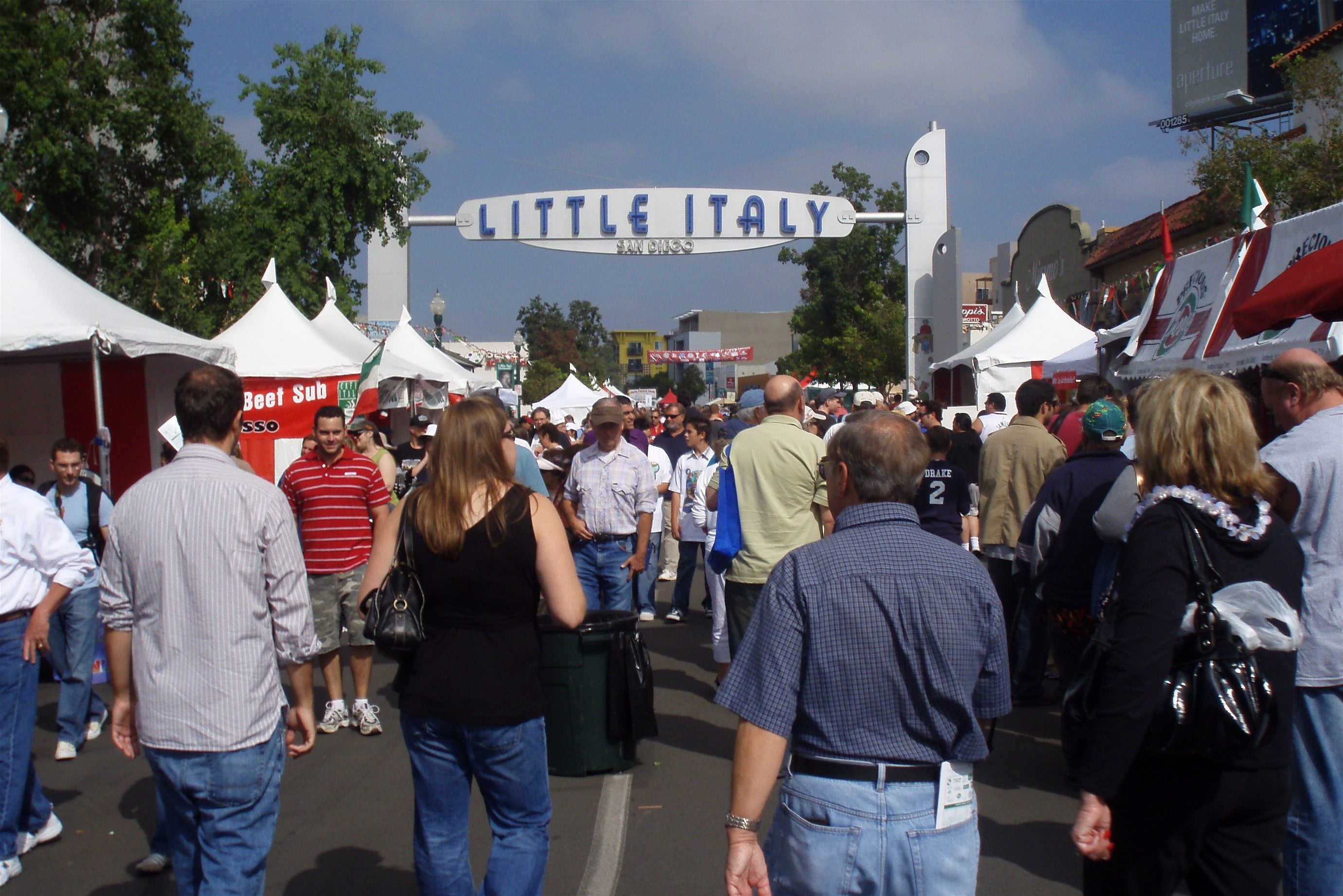 Crowds at the Little Italy Mercato under the Little Italy sign