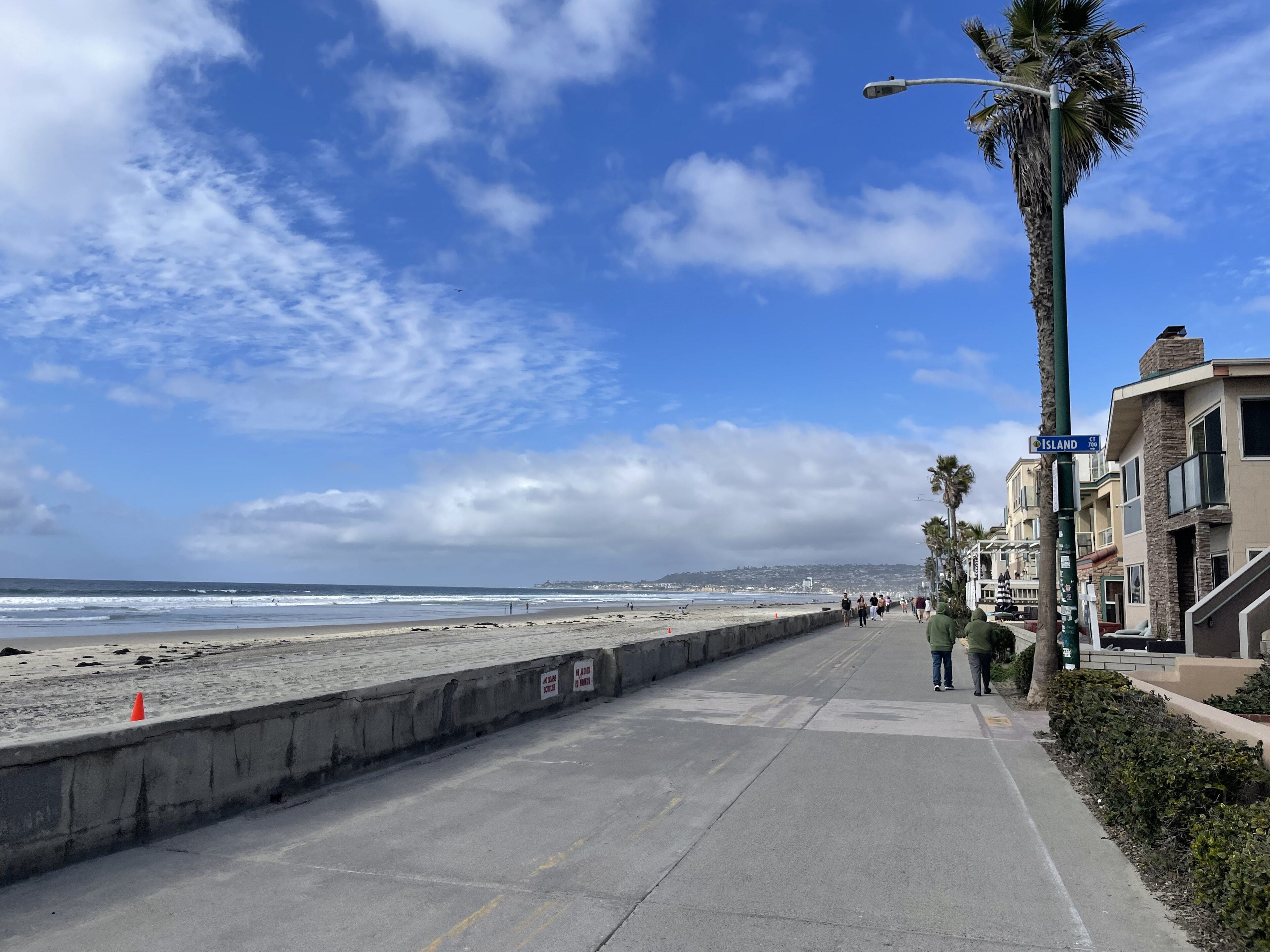 The Mission Beach boardwalk along the sand