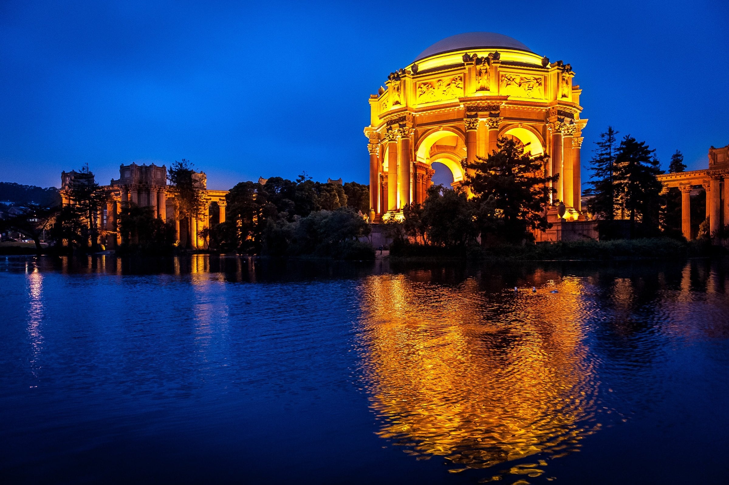 Palace of Fine Arts rotunda reflected in the lagoon at blue hour