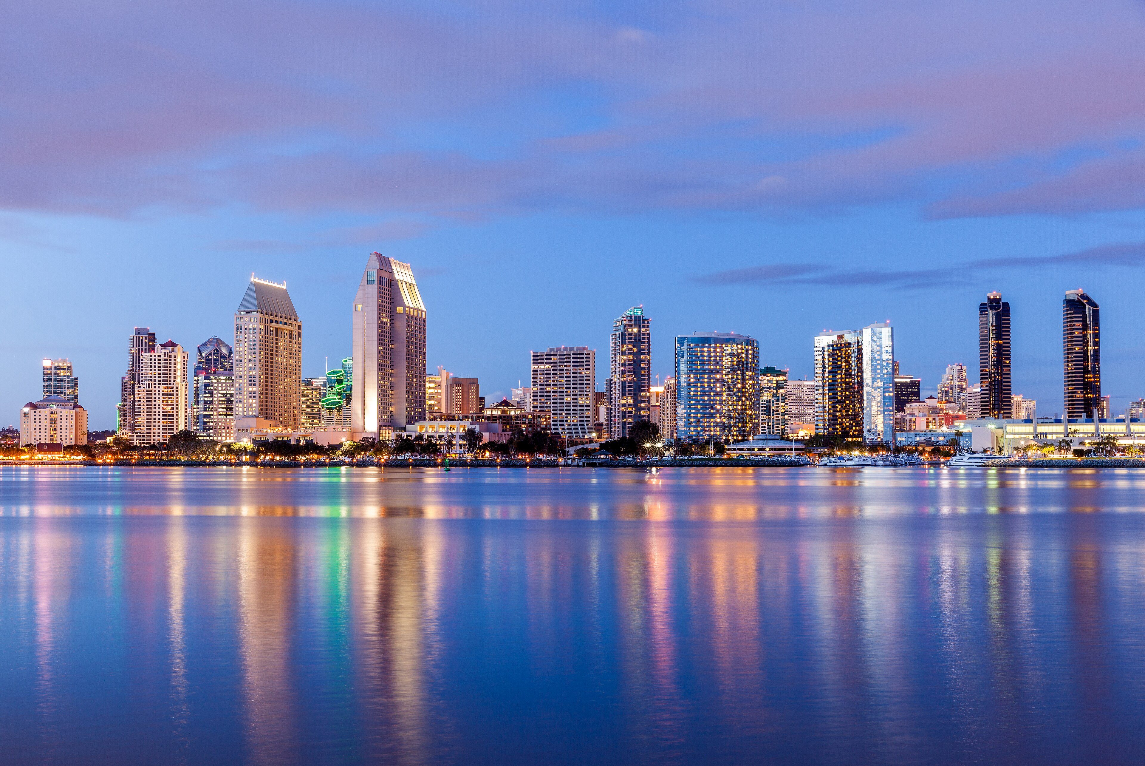 The downtown San Diego skyline across the bay from Coronado at dusk