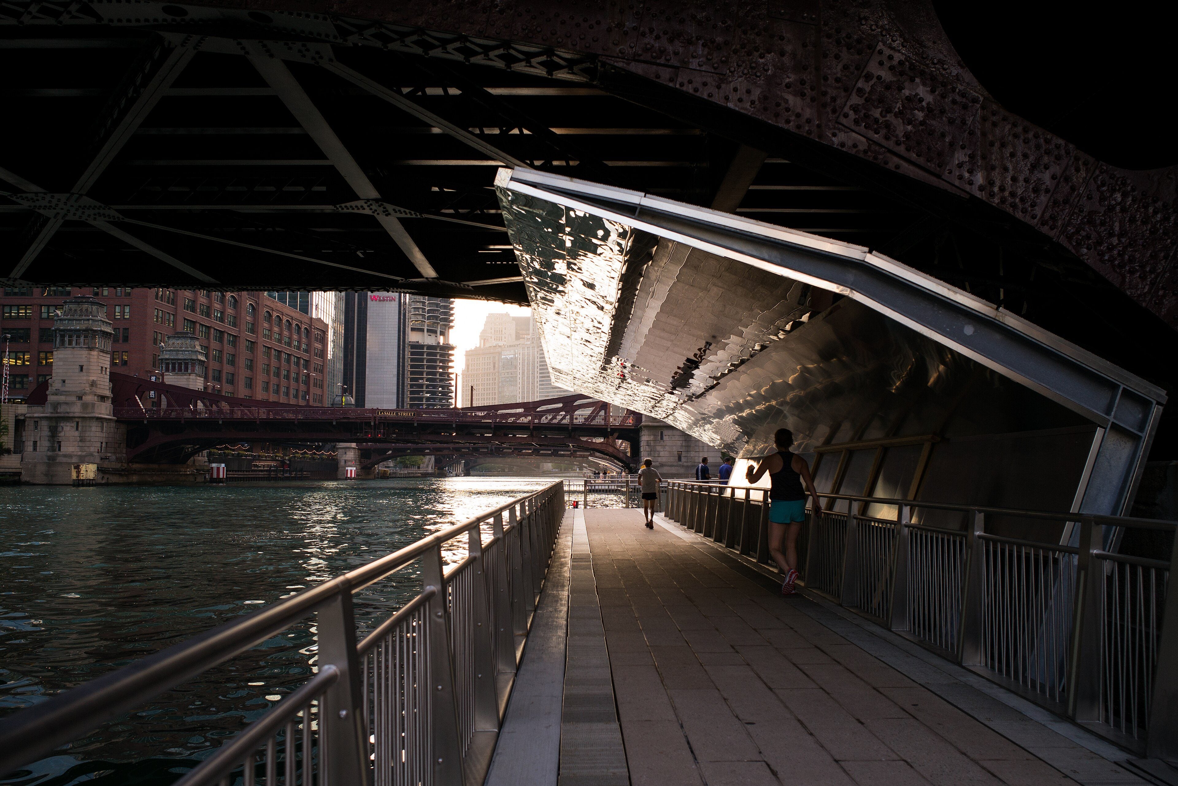 The Chicago Riverwalk under a bridge along the main branch of the river