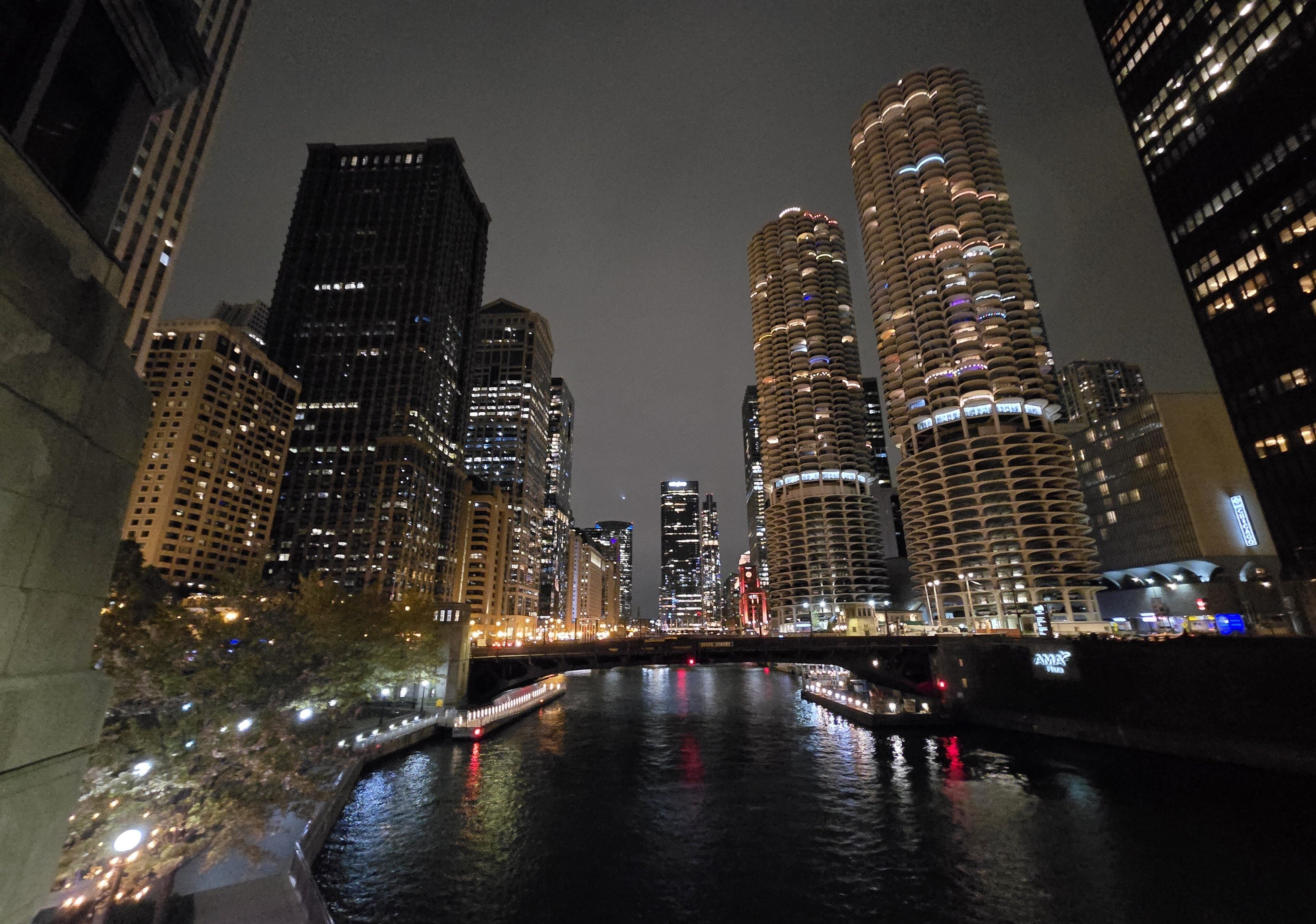 Marina City's towers and the State Street Bridge over the Chicago River at night