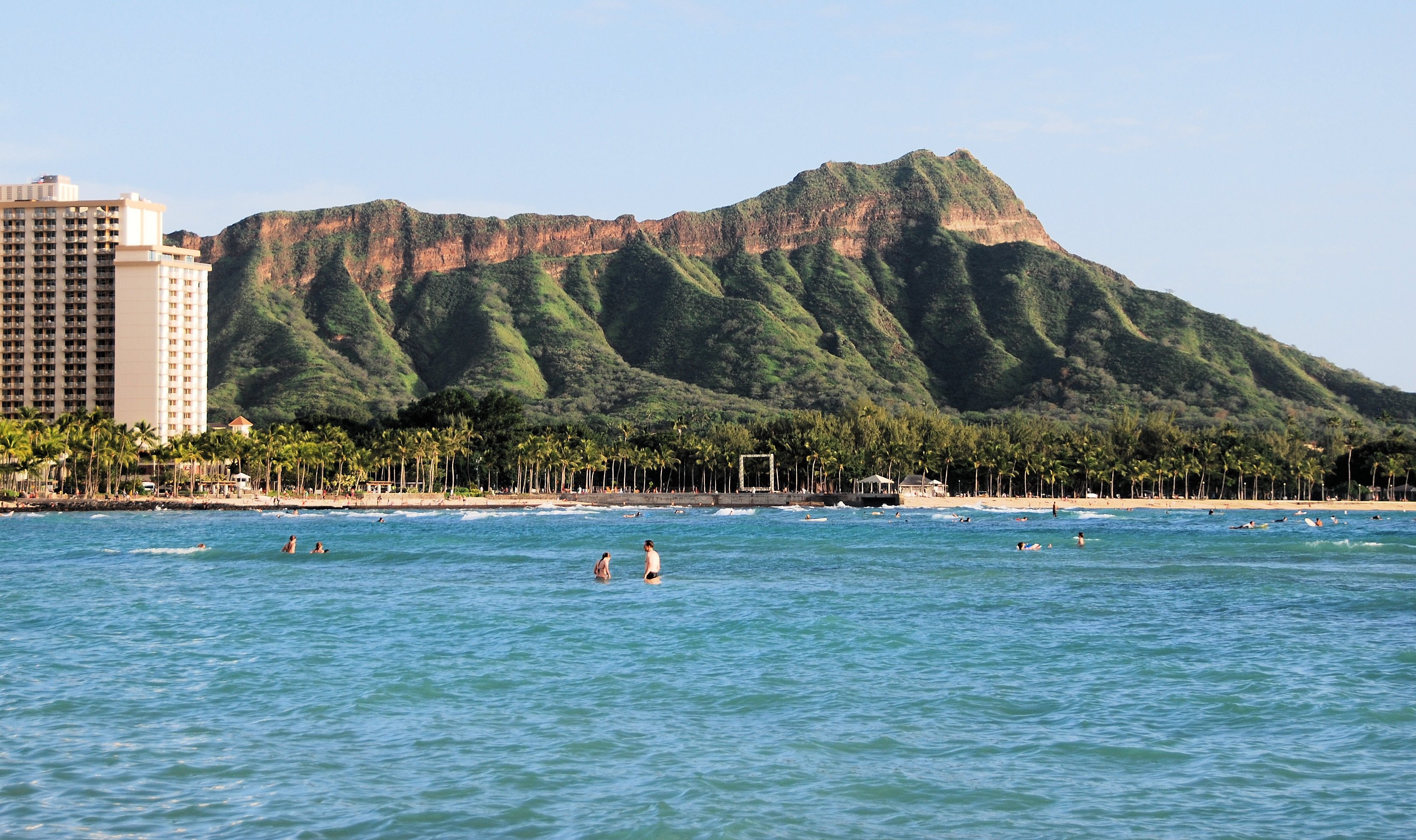 Diamond Head rising behind the water at Waikīkī Beach