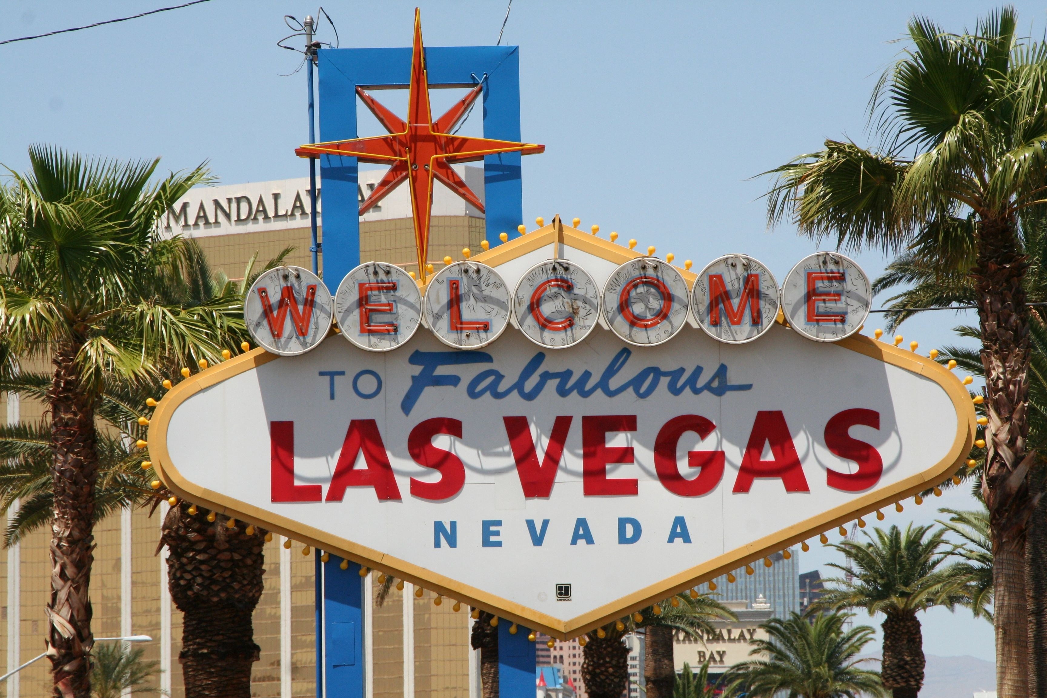 The Welcome to Fabulous Las Vegas sign on the south end of the Strip, framed by palms