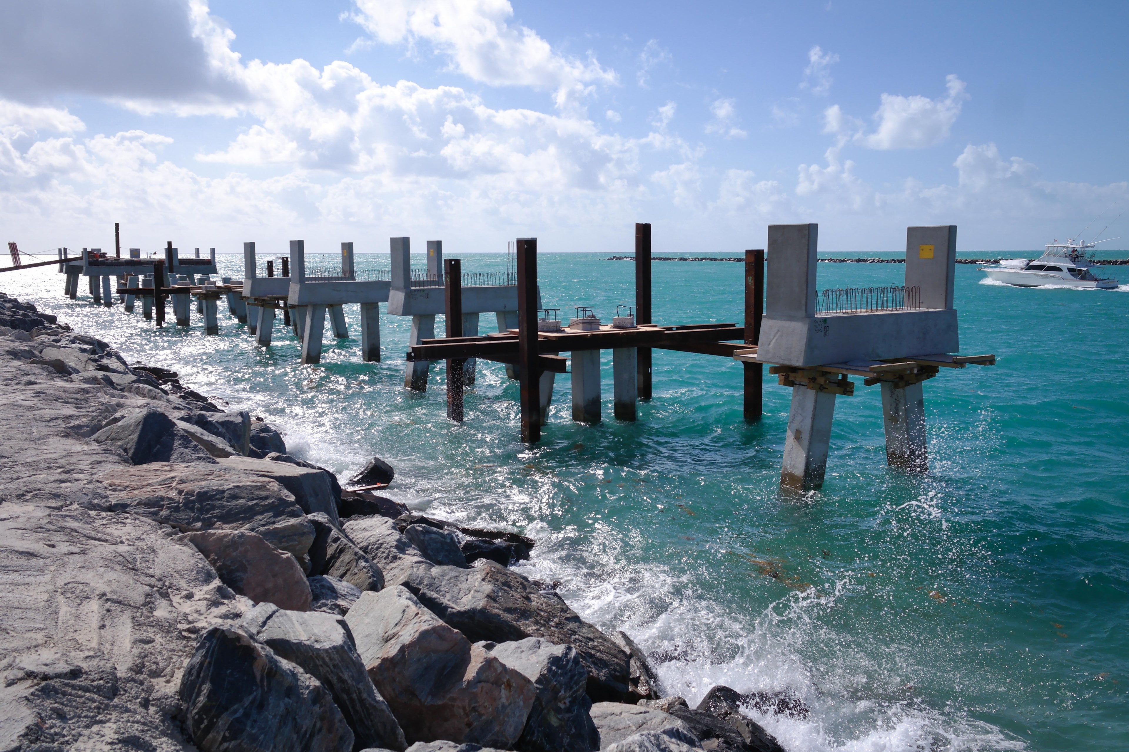 Waves breaking along the jetty by South Pointe Park Pier