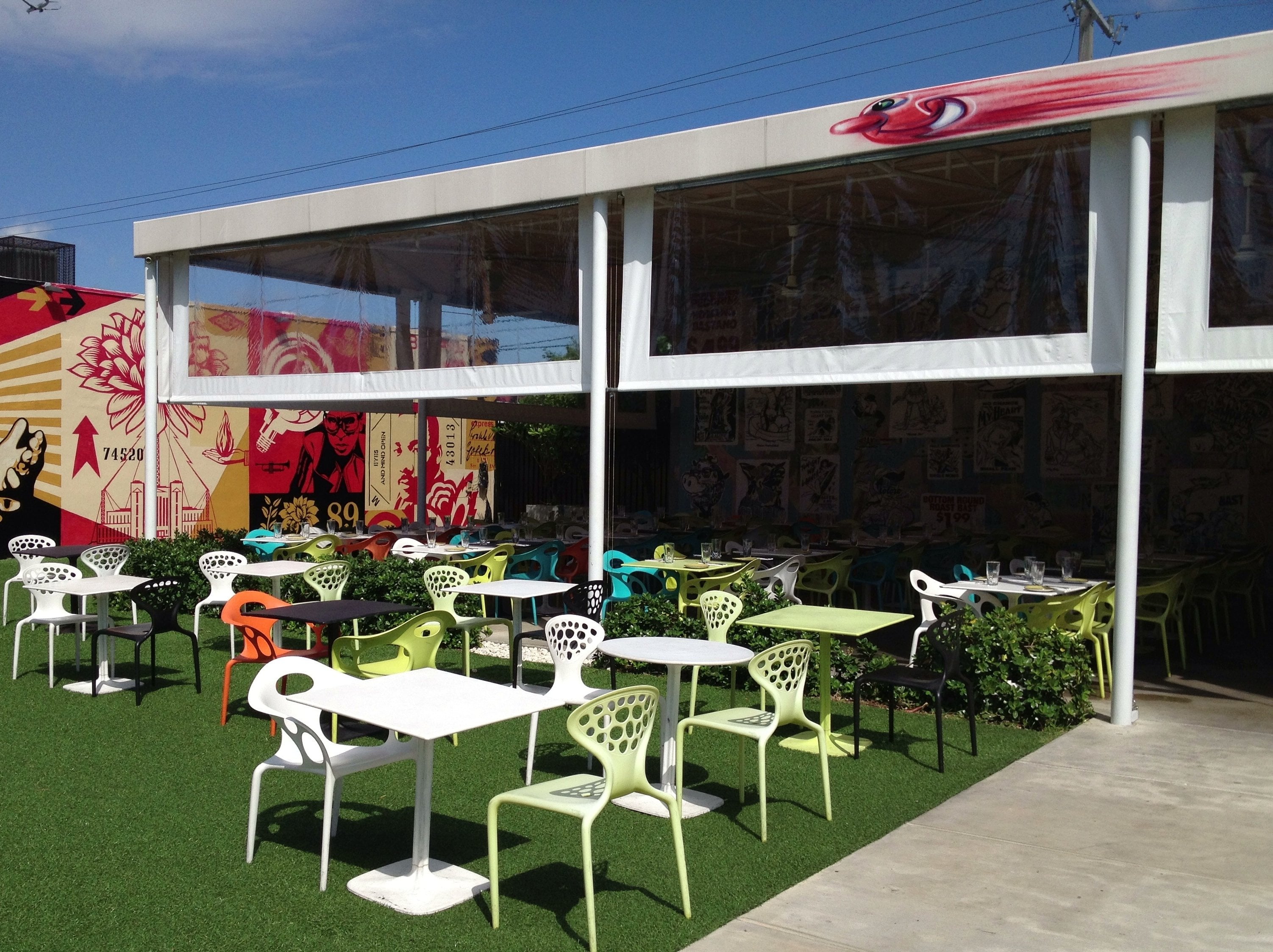 Murals and cafe tables inside the Wynwood Walls garden