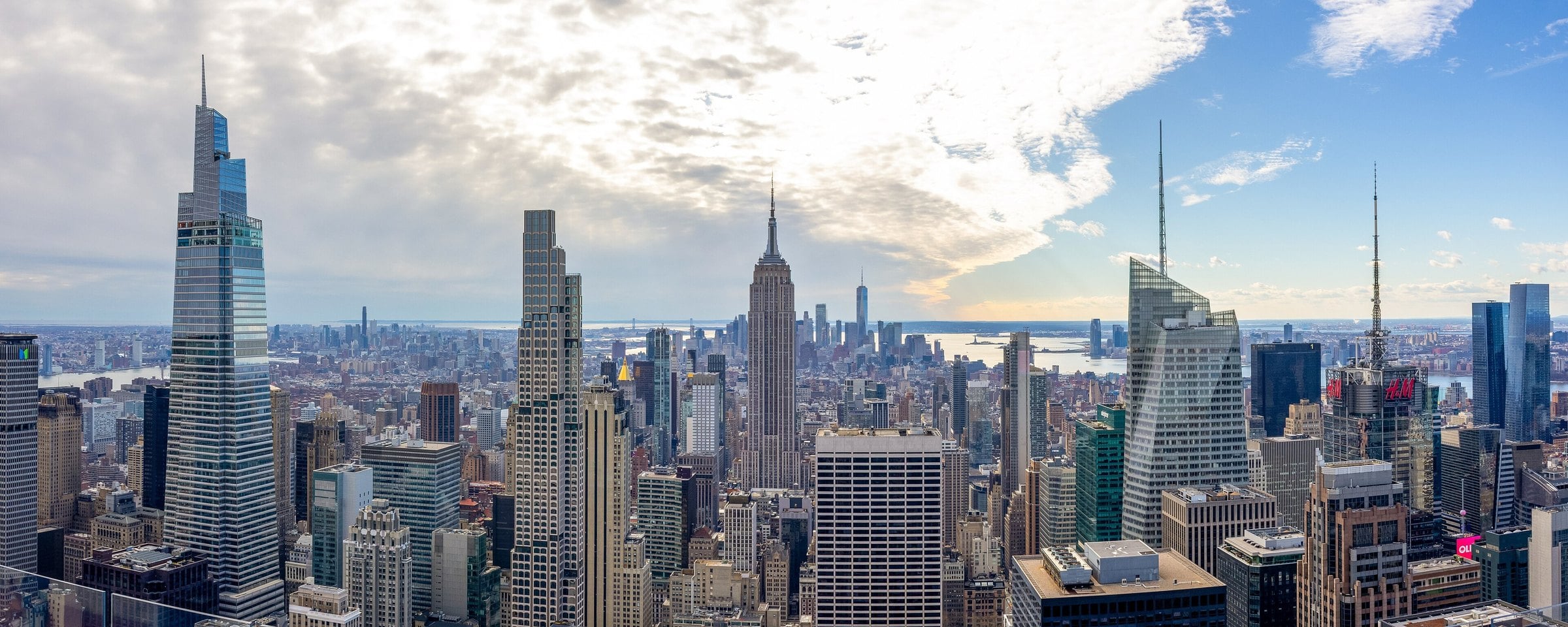 Midtown Manhattan skyline under blue sky from the Top of the Rock deck