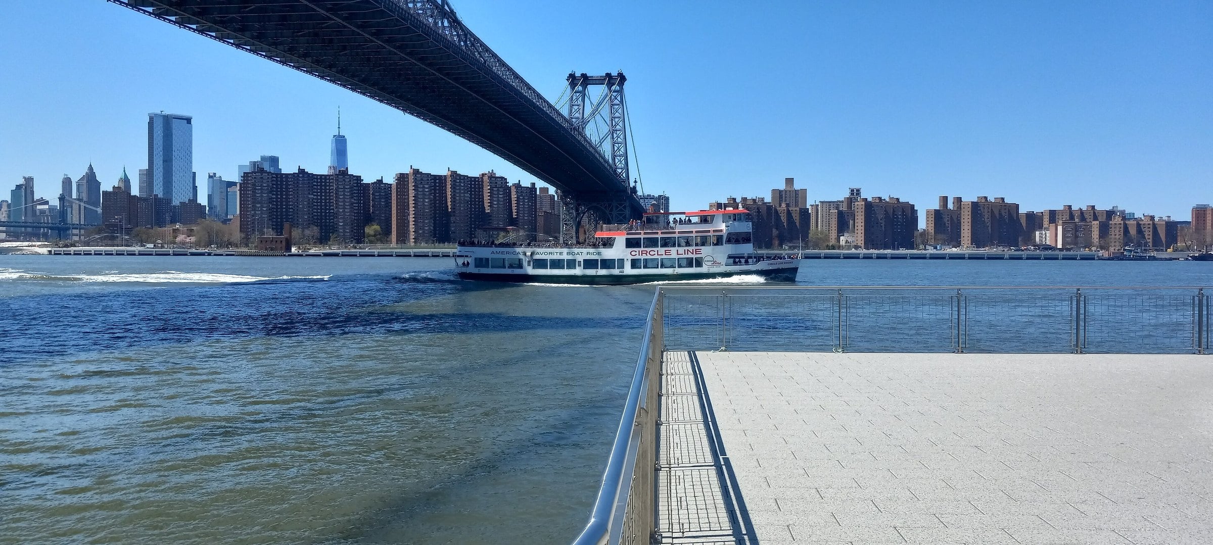 Williamsburg Bridge and Manhattan skyline from the Domino Park pier