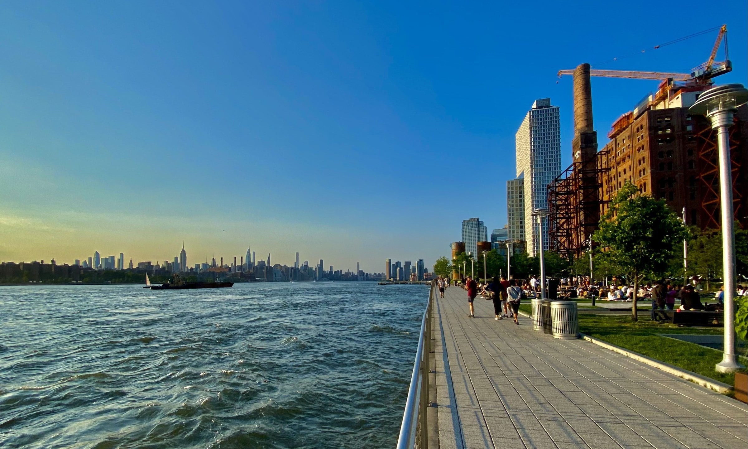 Williamsburg waterfront promenade with Manhattan skyline across the river