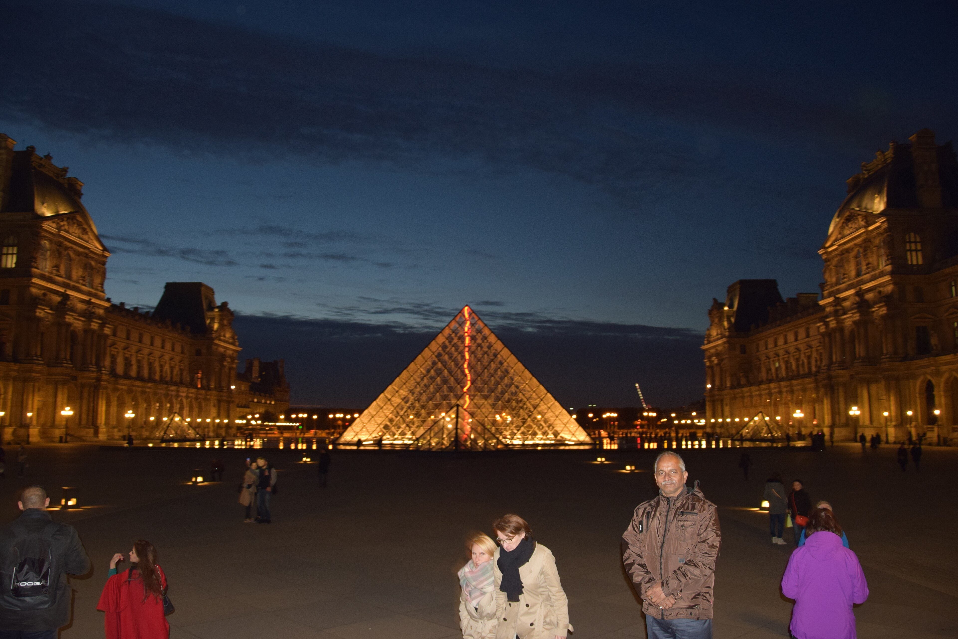 The Louvre Pyramid in the Cour Napoléon at dusk