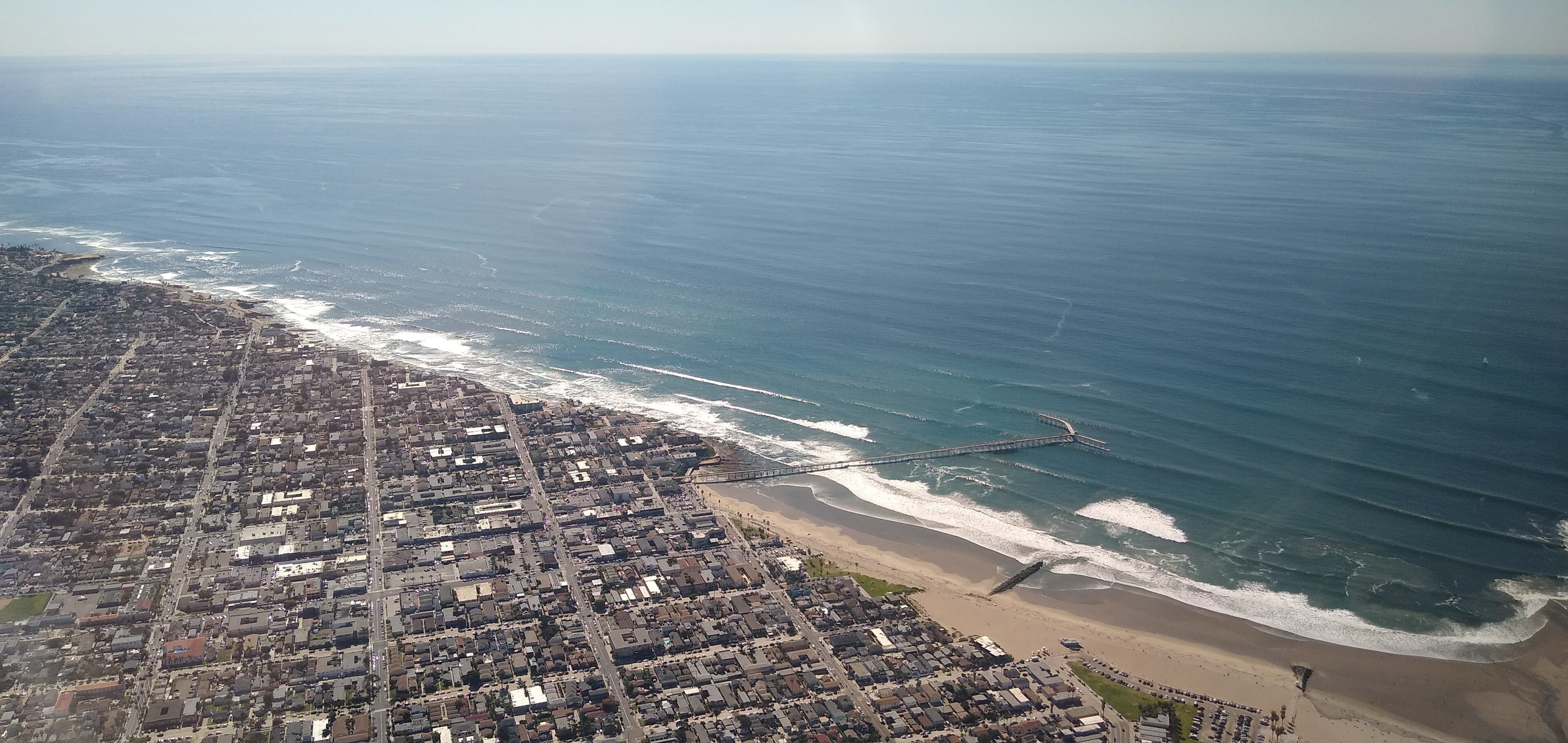 Aerial view of Ocean Beach's shoreline and neighborhood