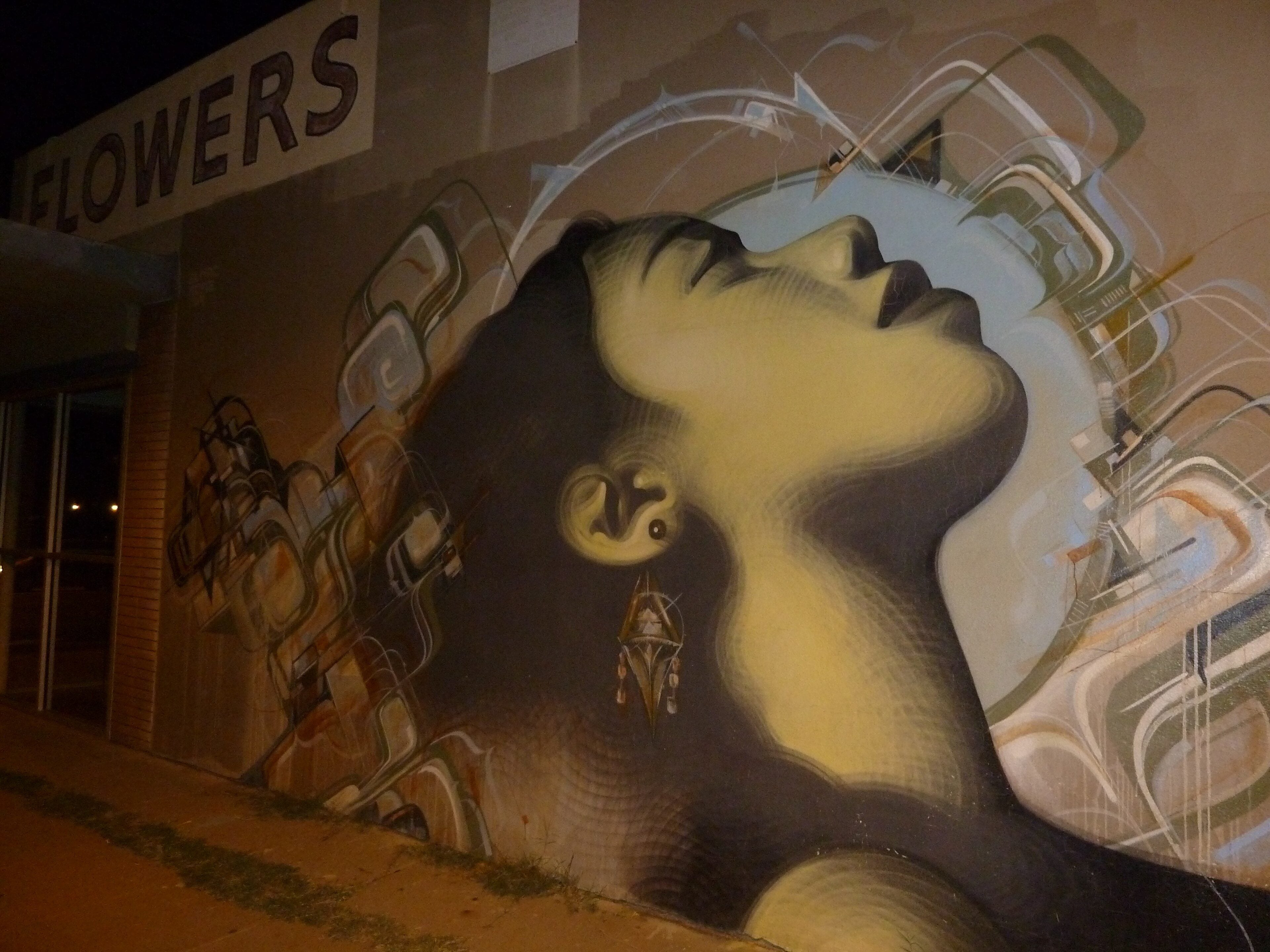 A large portrait mural on Roosevelt Row